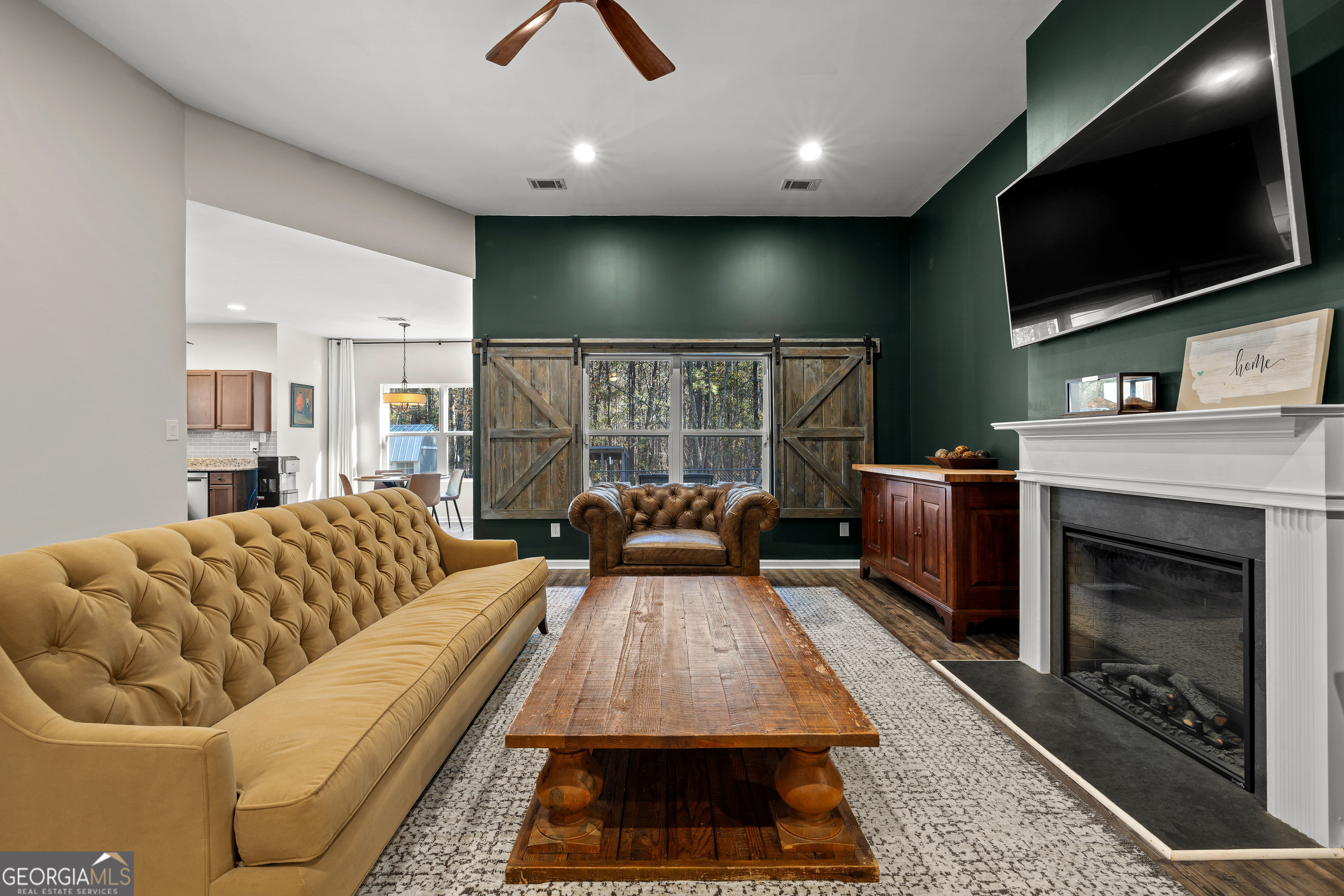 75 Homer Johnson Road Newnan, GA 30265 - Photo 14 of 51 a living room with furniture and a flat screen tv