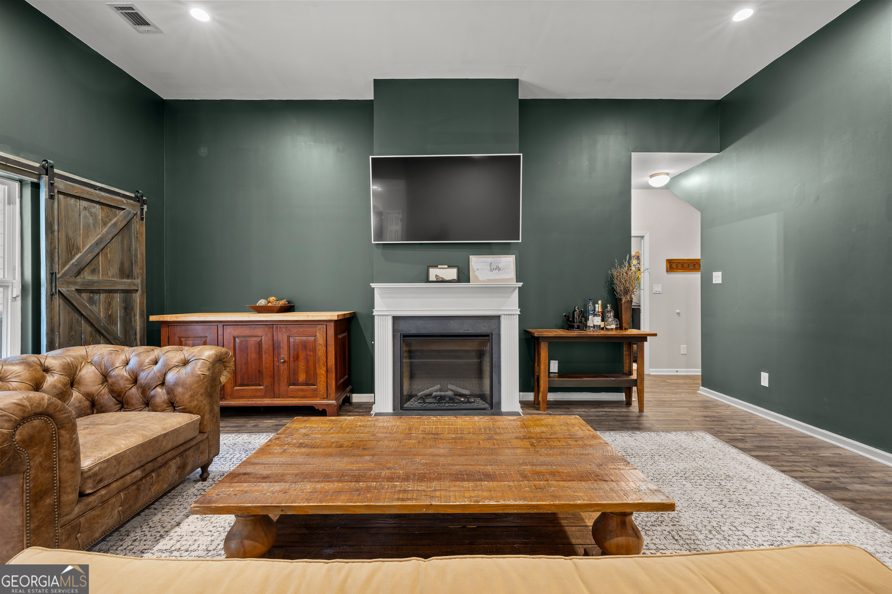 75 Homer Johnson Road Newnan, GA 30265 - Photo 15 of 51 a living room with furniture and a fireplace