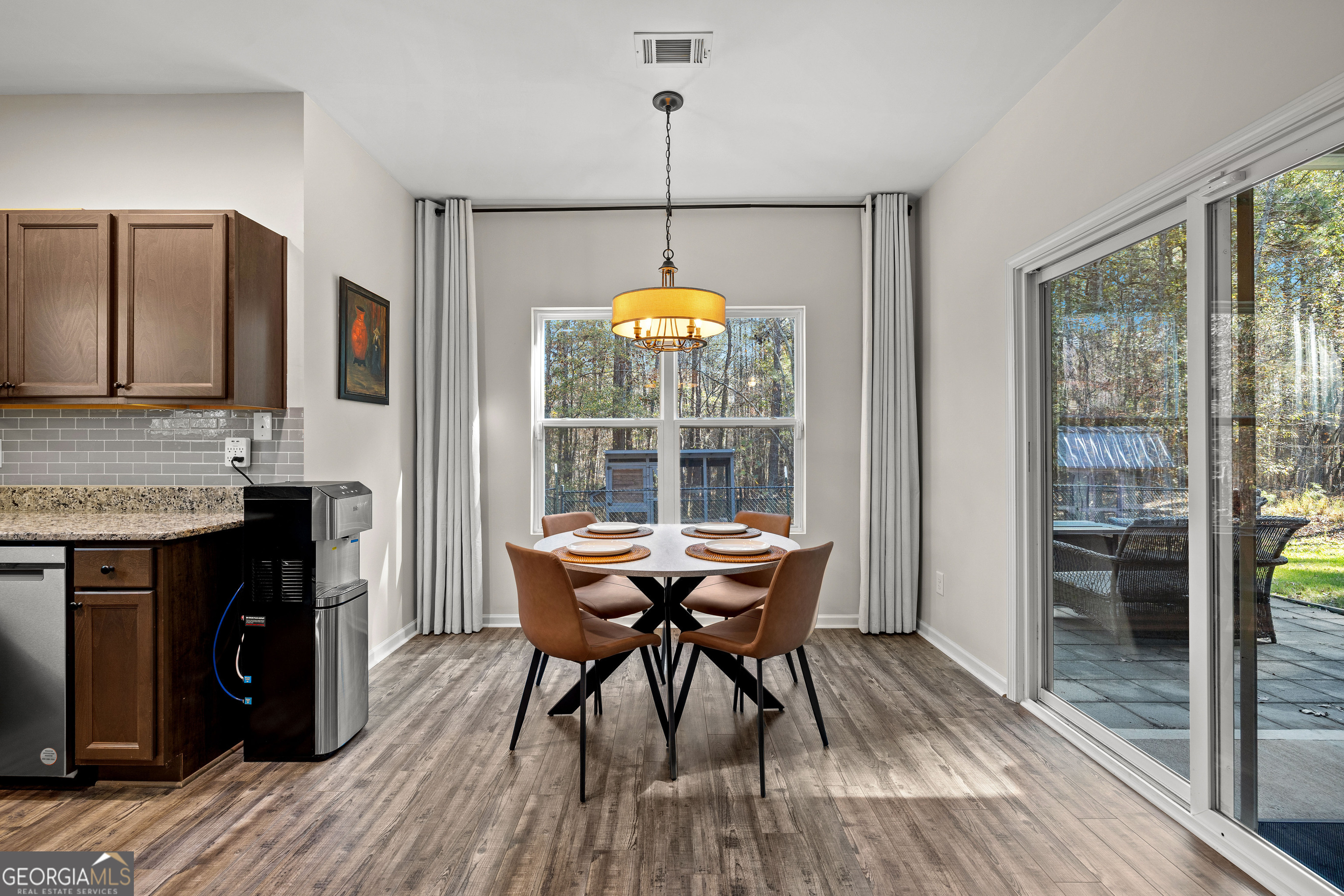 75 Homer Johnson Road Newnan, GA 30265 - Photo 19 of 51 a view of a dining room with furniture window and outside view