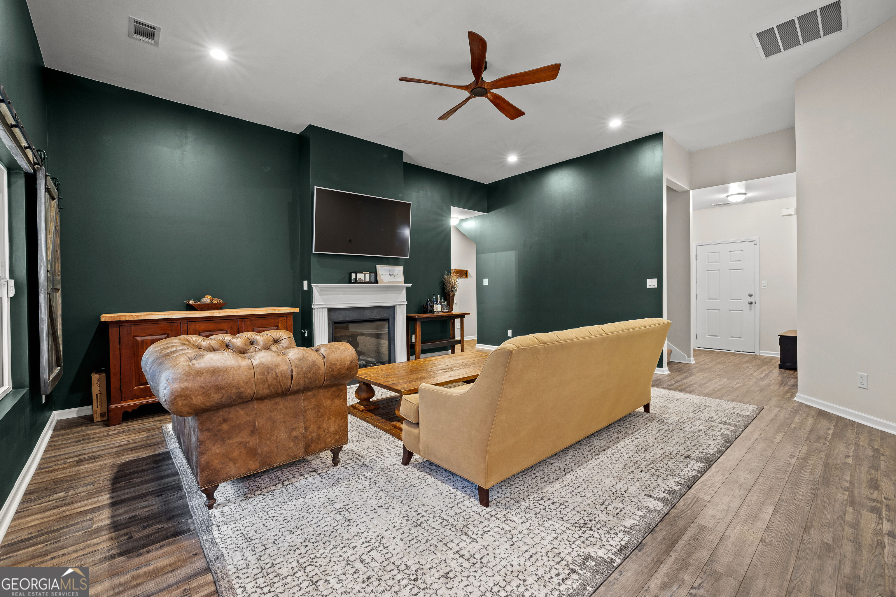75 Homer Johnson Road Newnan, GA 30265 - Photo 20 of 51 a living room with furniture and a flat screen tv
