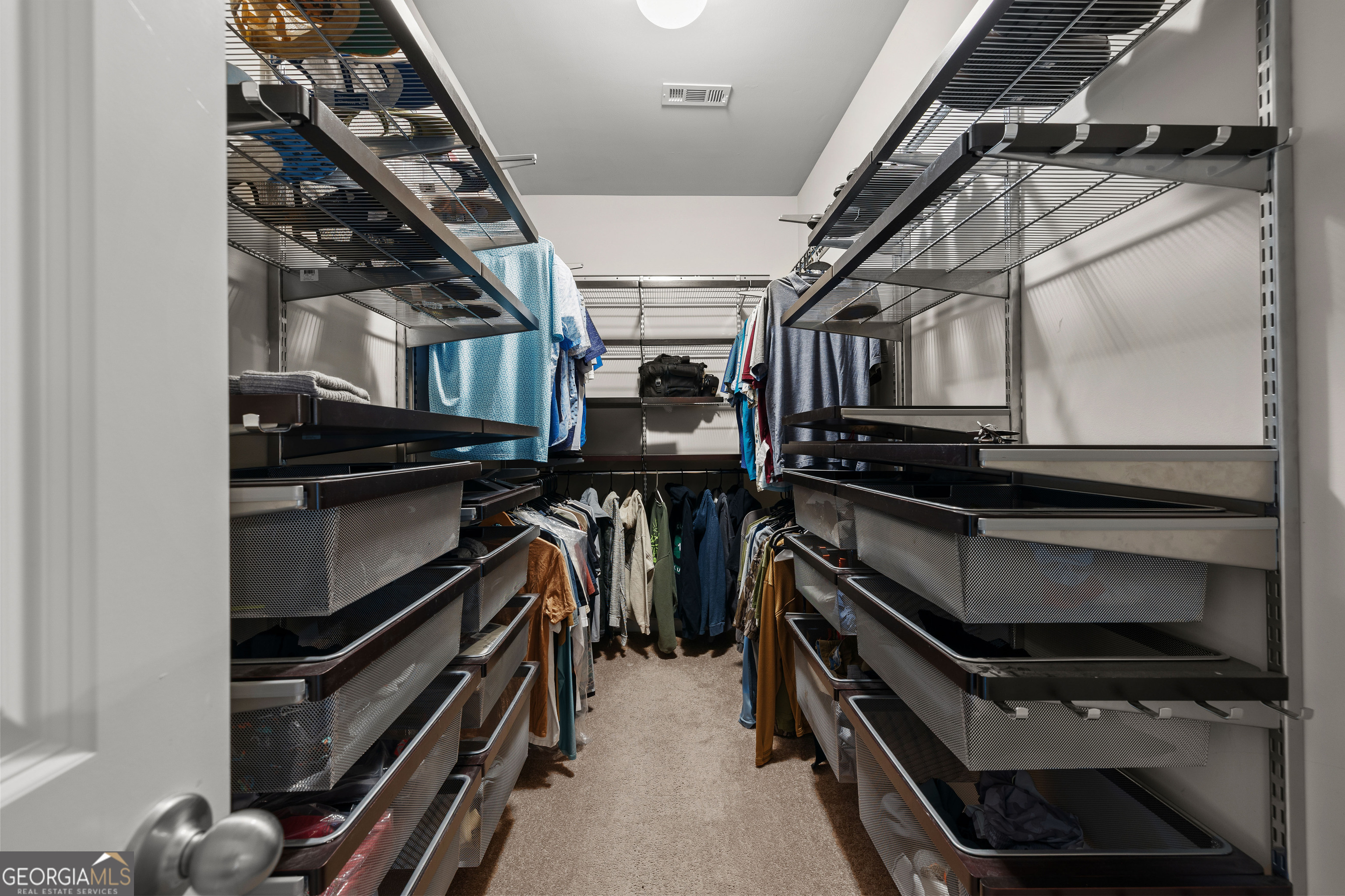 75 Homer Johnson Road Newnan, GA 30265 - Photo 29 of 51 a view of walk in closet with wooden floor