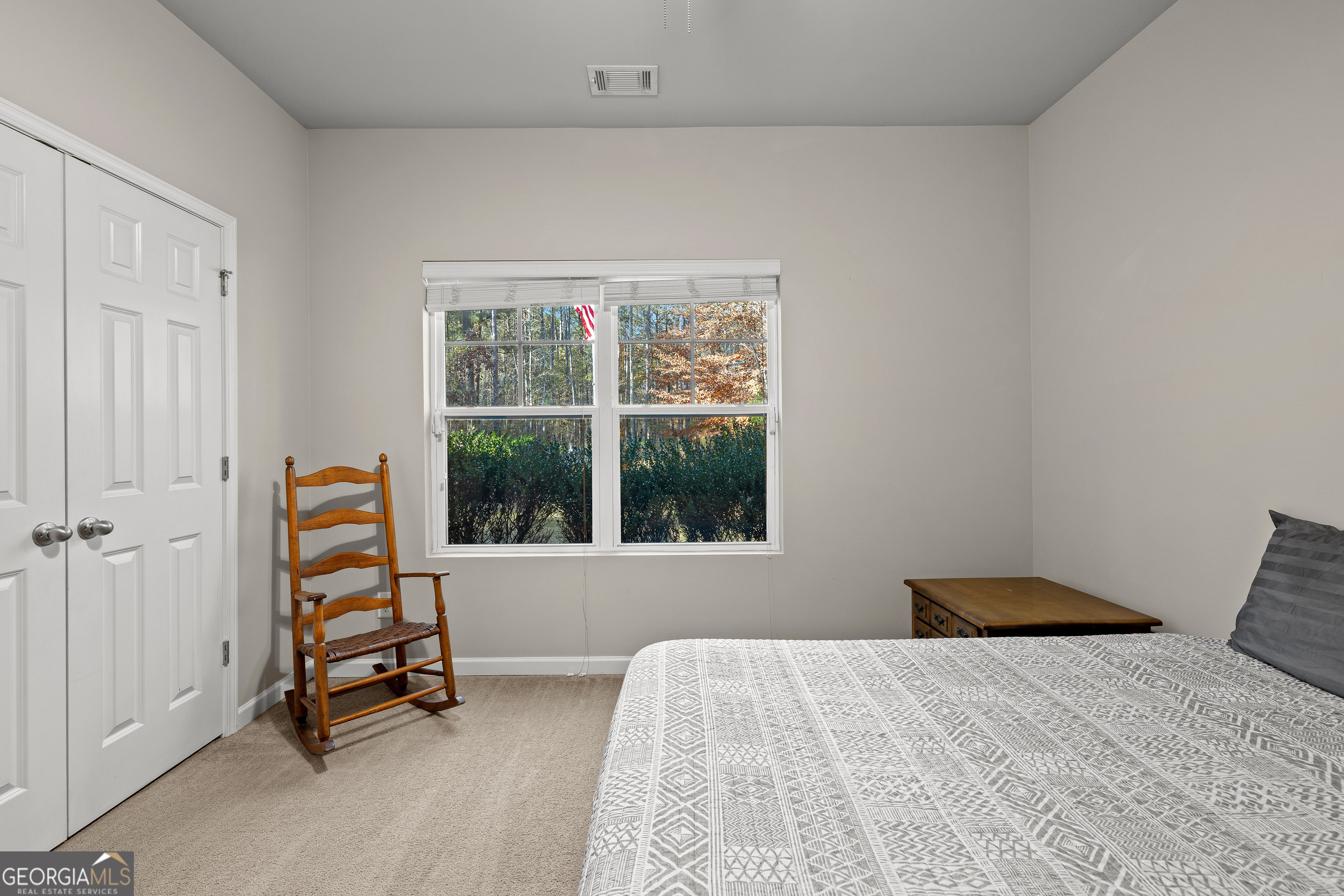 75 Homer Johnson Road Newnan, GA 30265 - Photo 32 of 51 a bedroom with a bed and a window