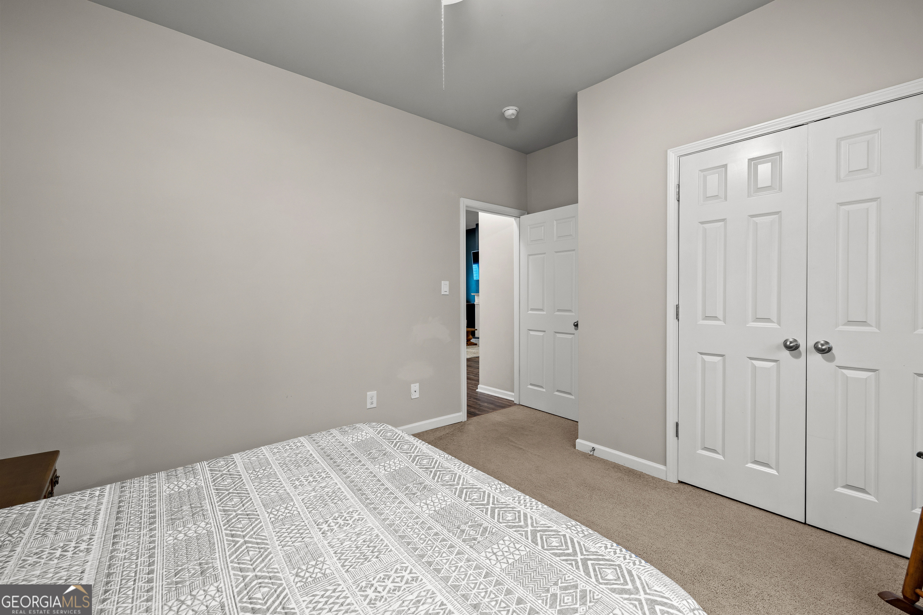75 Homer Johnson Road Newnan, GA 30265 - Photo 33 of 51 a view of a room with a bed and wooden floor