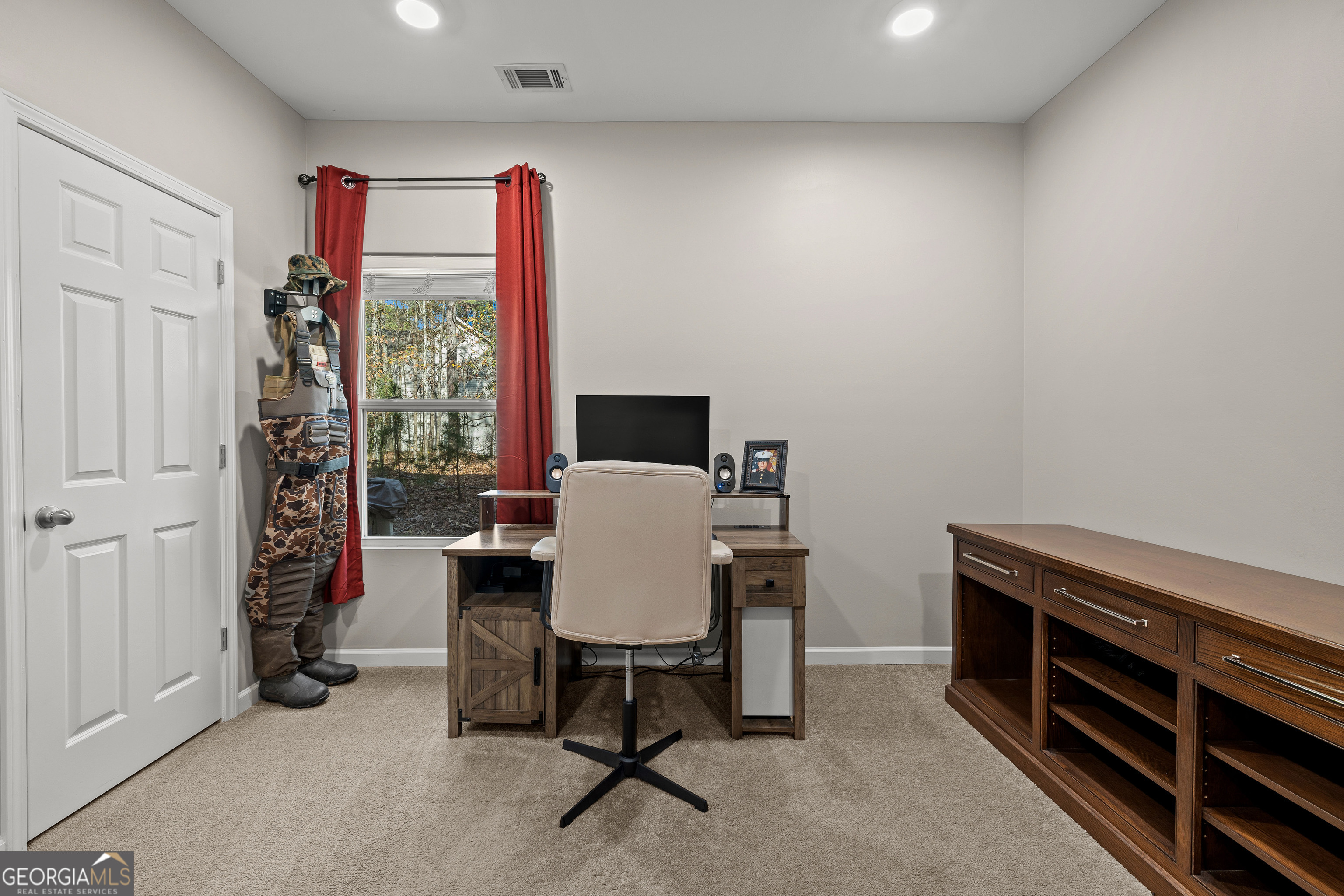 75 Homer Johnson Road Newnan, GA 30265 - Photo 36 of 51 a view of a workspace with furniture and a window