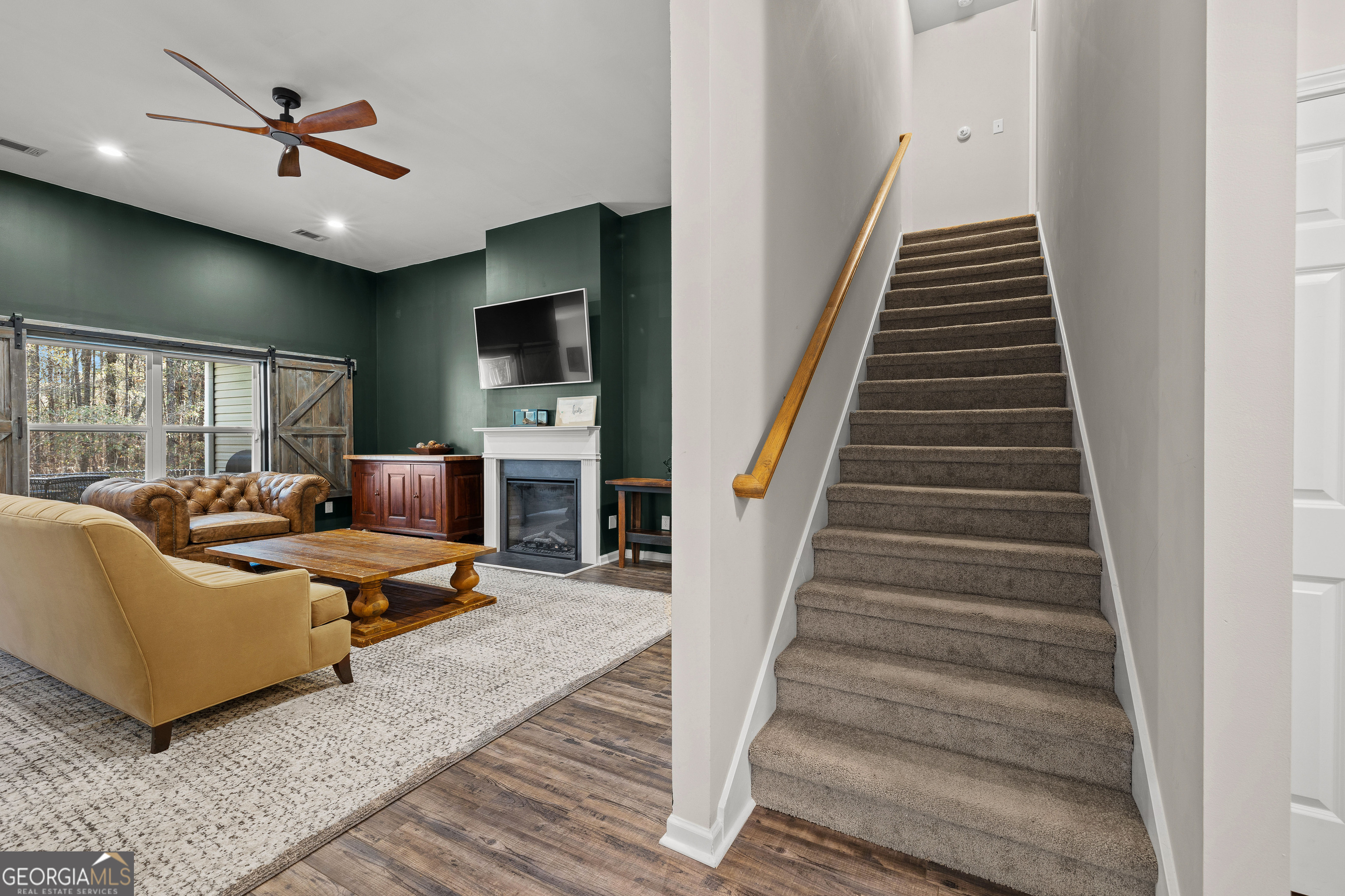 75 Homer Johnson Road Newnan, GA 30265 - Photo 38 of 51 a living room with furniture and a flat screen tv