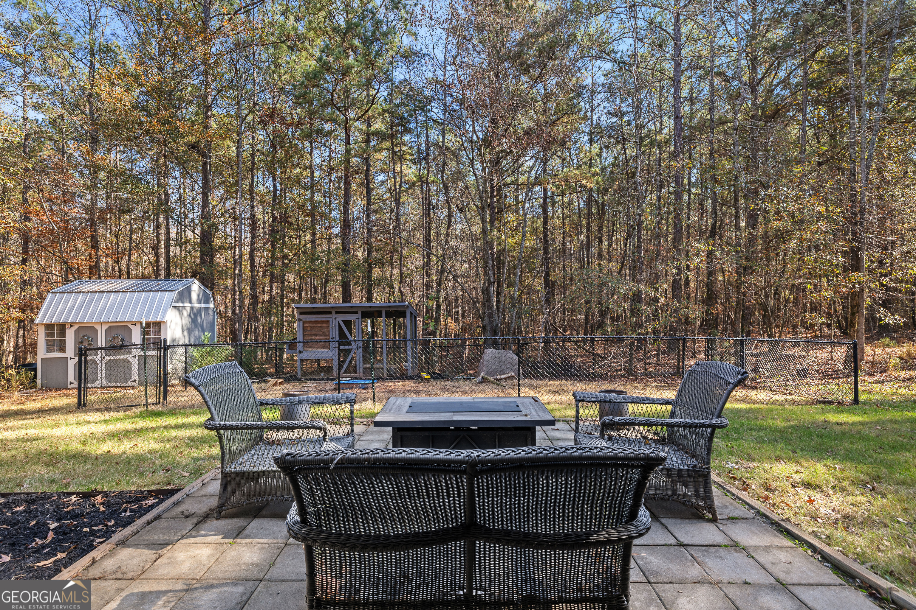 75 Homer Johnson Road Newnan, GA 30265 - Photo 44 of 51 a backyard of a house with yard and outdoor seating