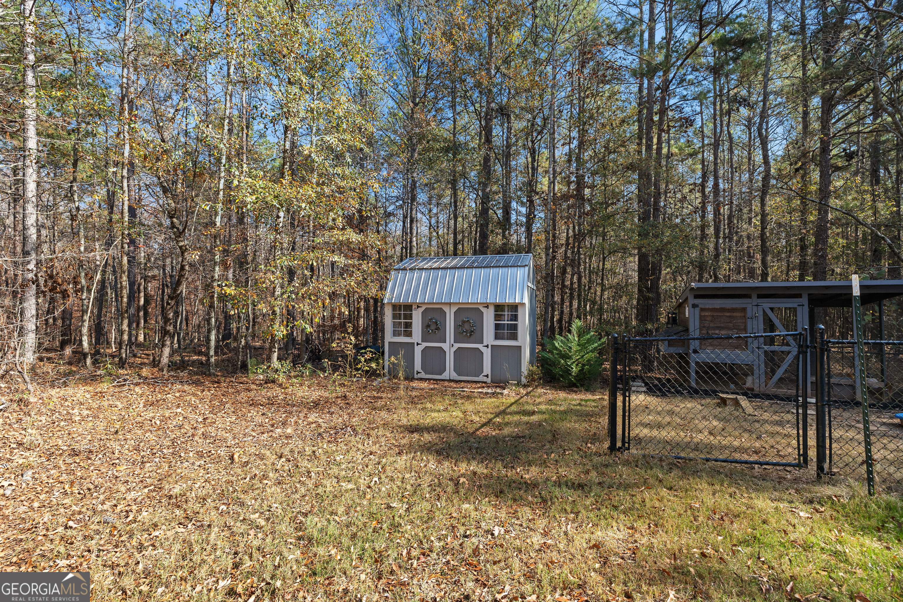 75 Homer Johnson Road Newnan, GA 30265 - Photo 45 of 51 a house view with a backyard space