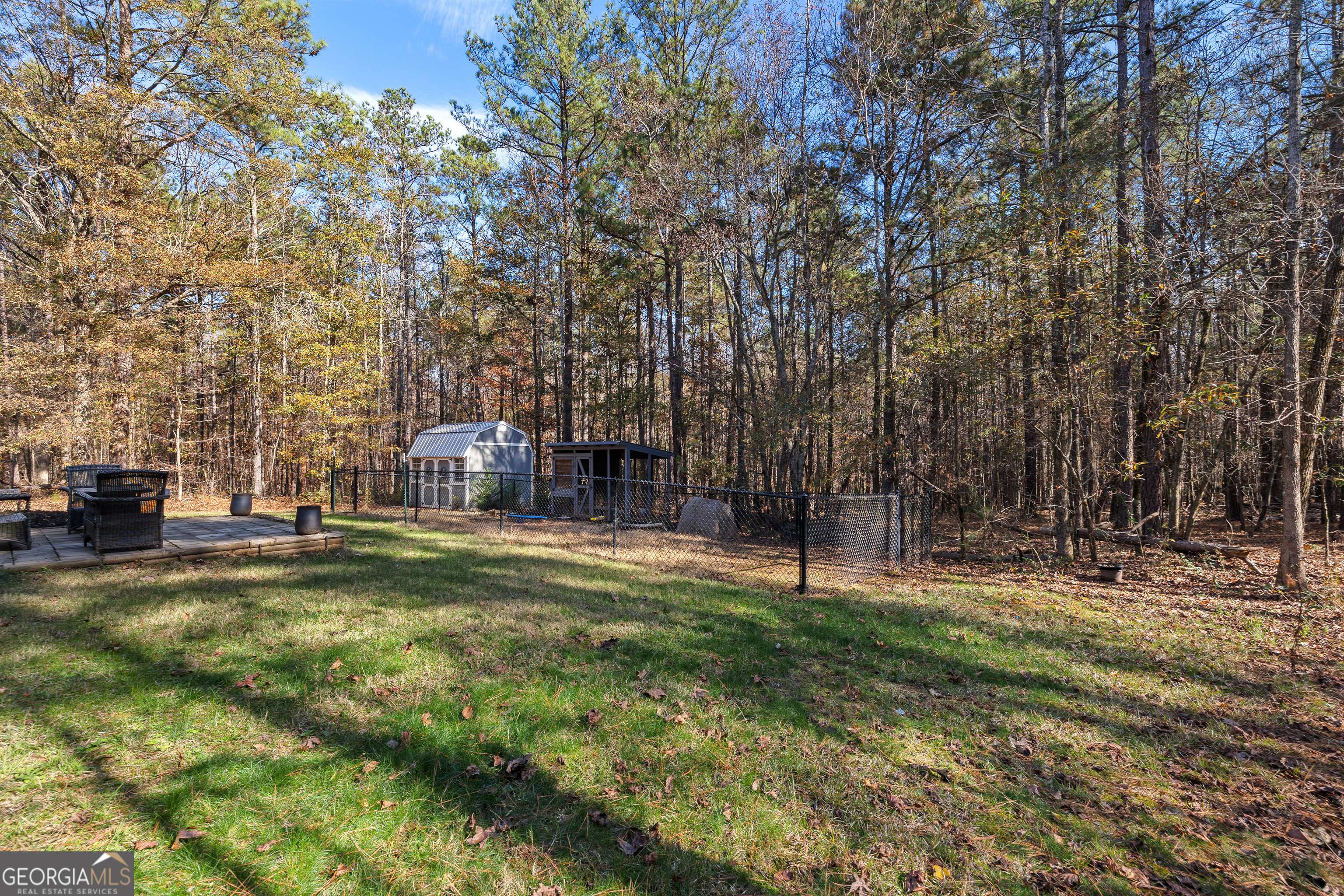 75 Homer Johnson Road Newnan, GA 30265 - Photo 47 of 51 a backyard of apartments with large trees