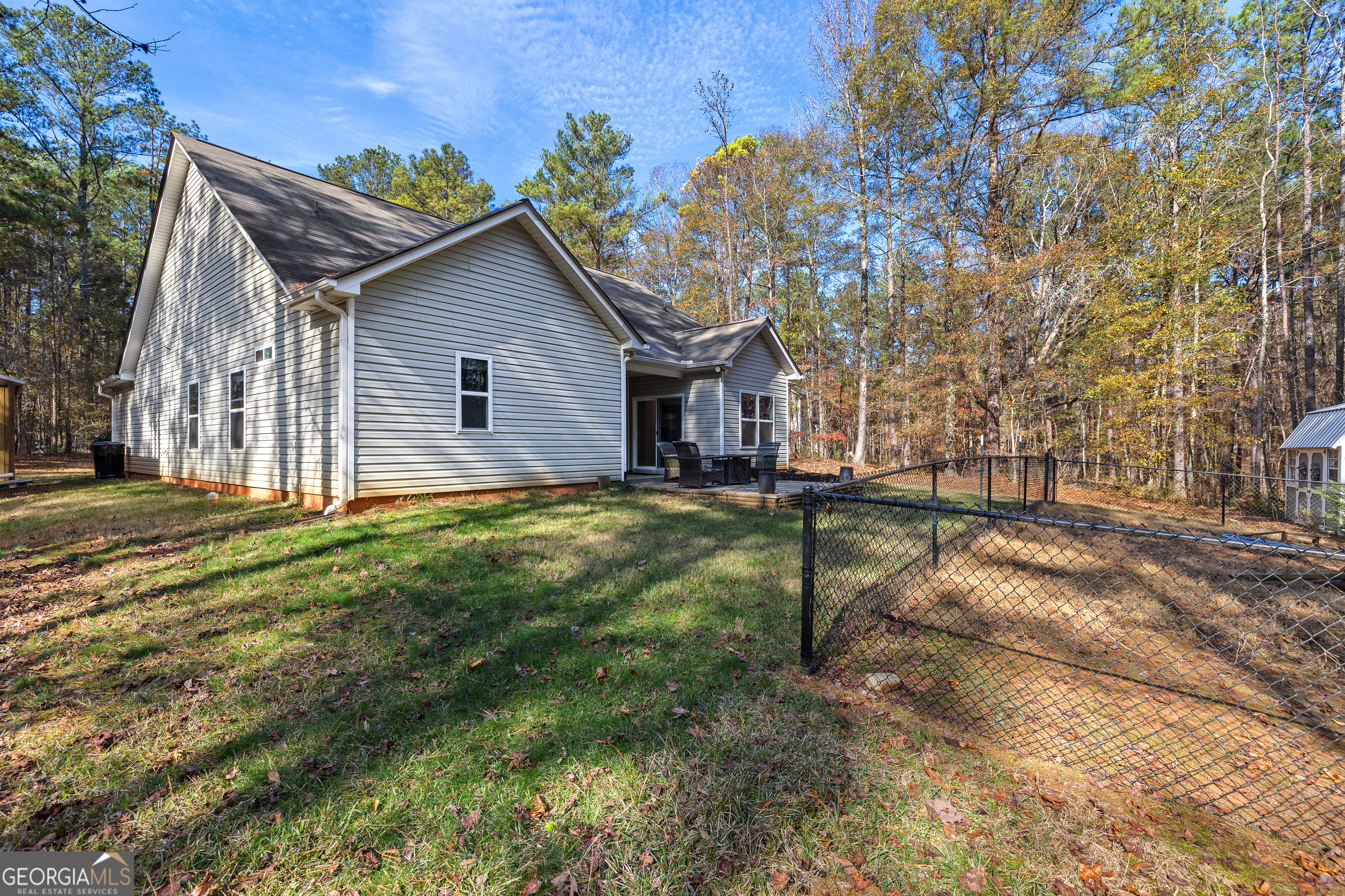 75 Homer Johnson Road Newnan, GA 30265 - Photo 50 of 51 a view of house with backyard and trees