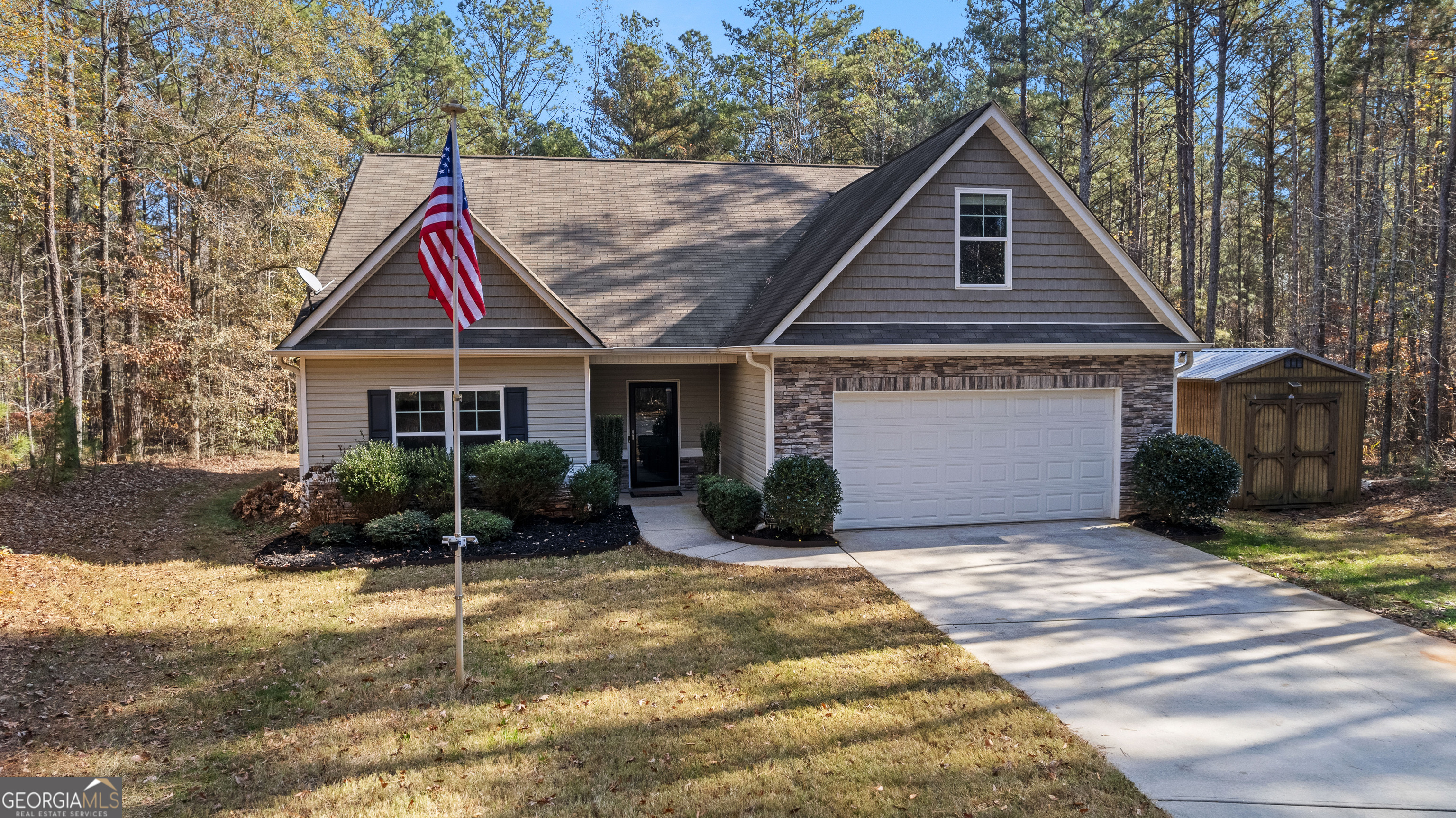 75 Homer Johnson Road Newnan, GA 30265 - Photo 51 of 51 a front view of a house with a yard and potted plants