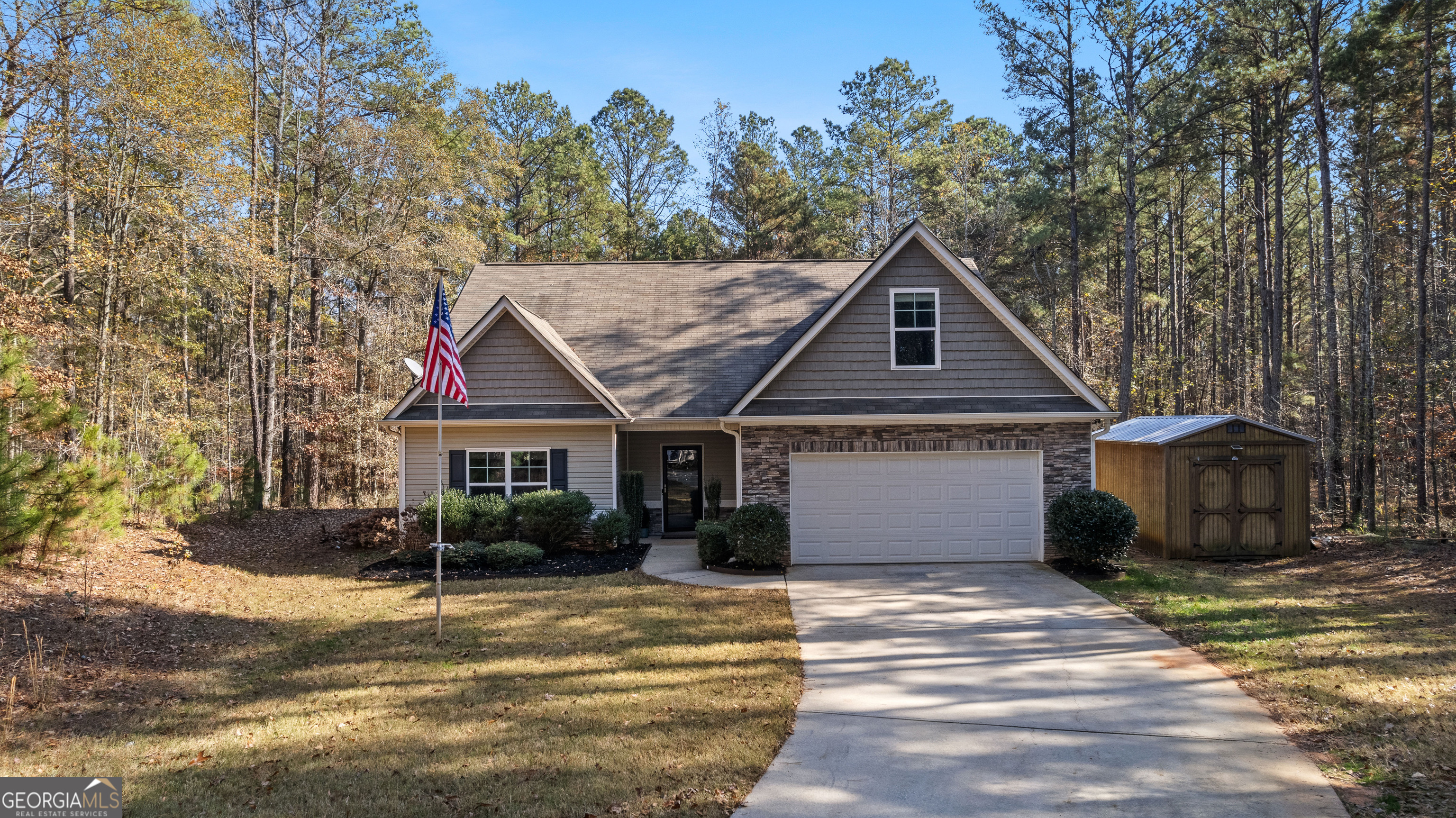 75 Homer Johnson Road Newnan, GA 30265 - Photo 7 of 51 a front view of a house with a yard and garage