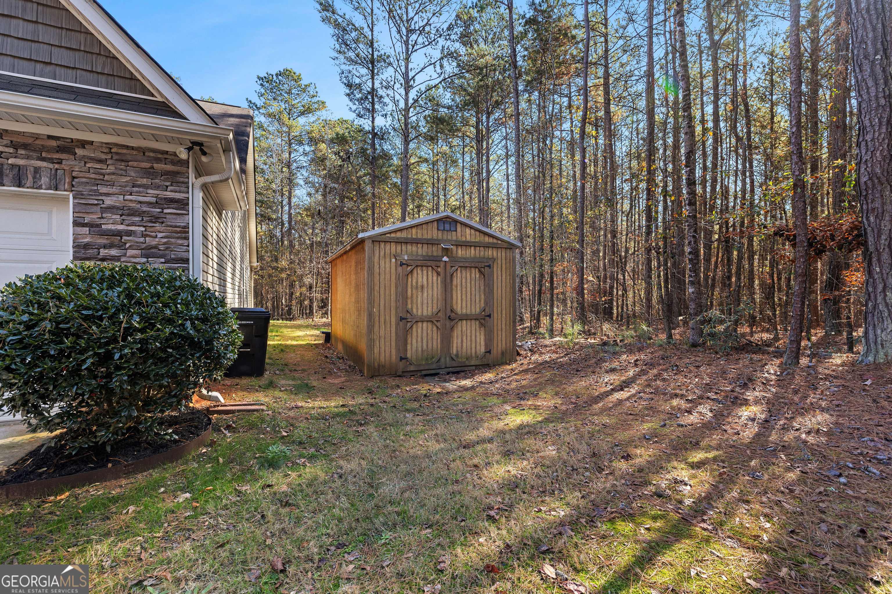 75 Homer Johnson Road Newnan, GA 30265 - Photo 8 of 51 a view of a backyard