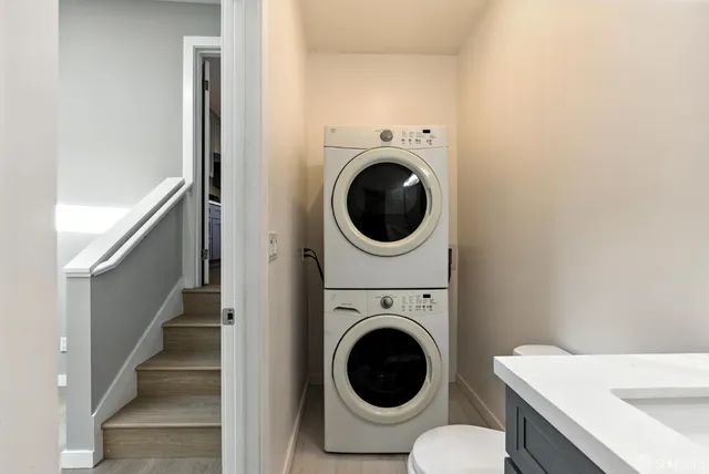 a view of a hallway with washer and dryer
