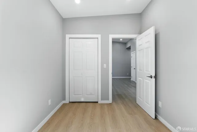 wooden floor in a hall with an entryway