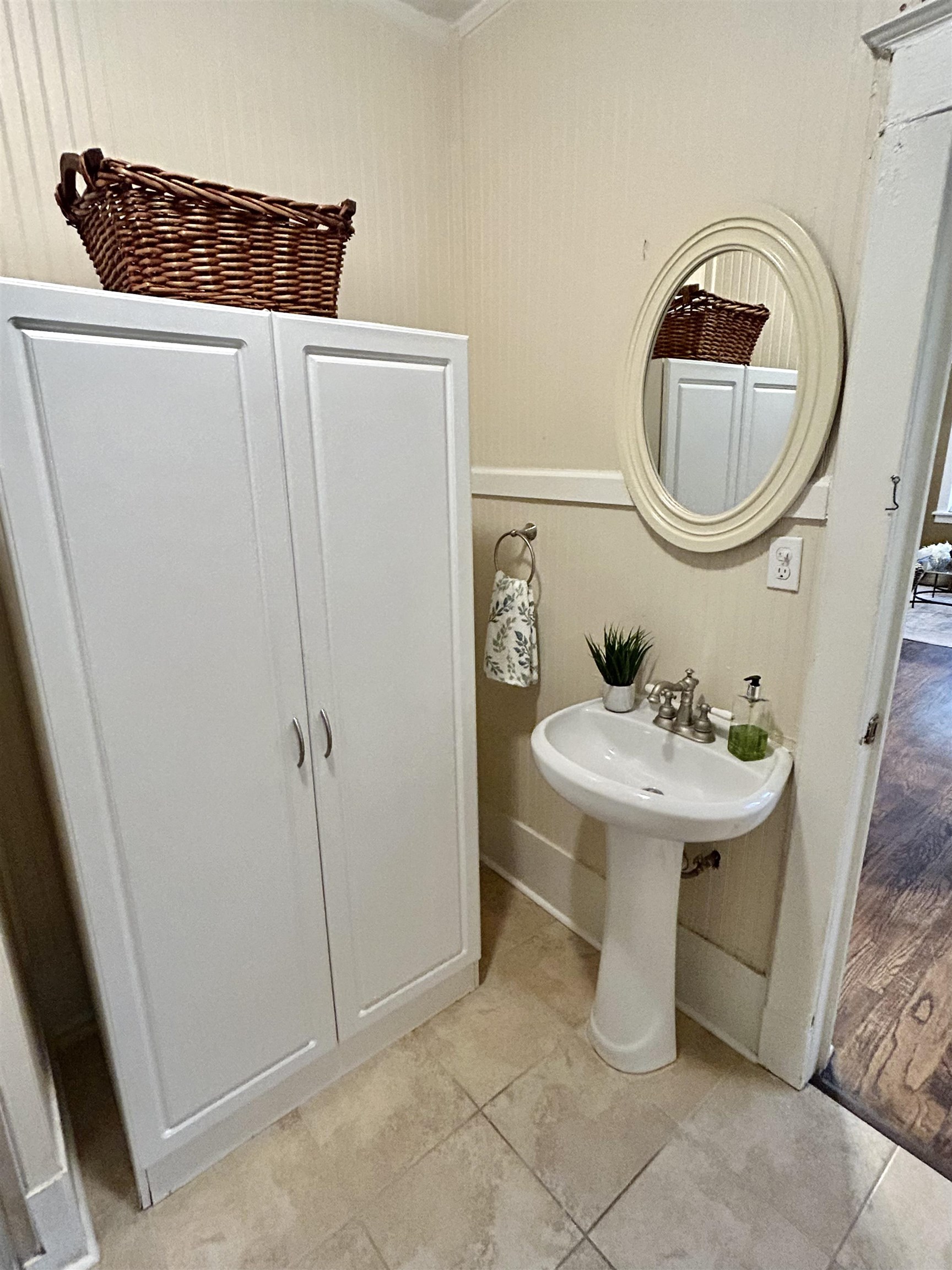 823 Cooper Street Memphis, TN 38104 - Photo 15 of 18 a bathroom with a sink a toilet and a mirror