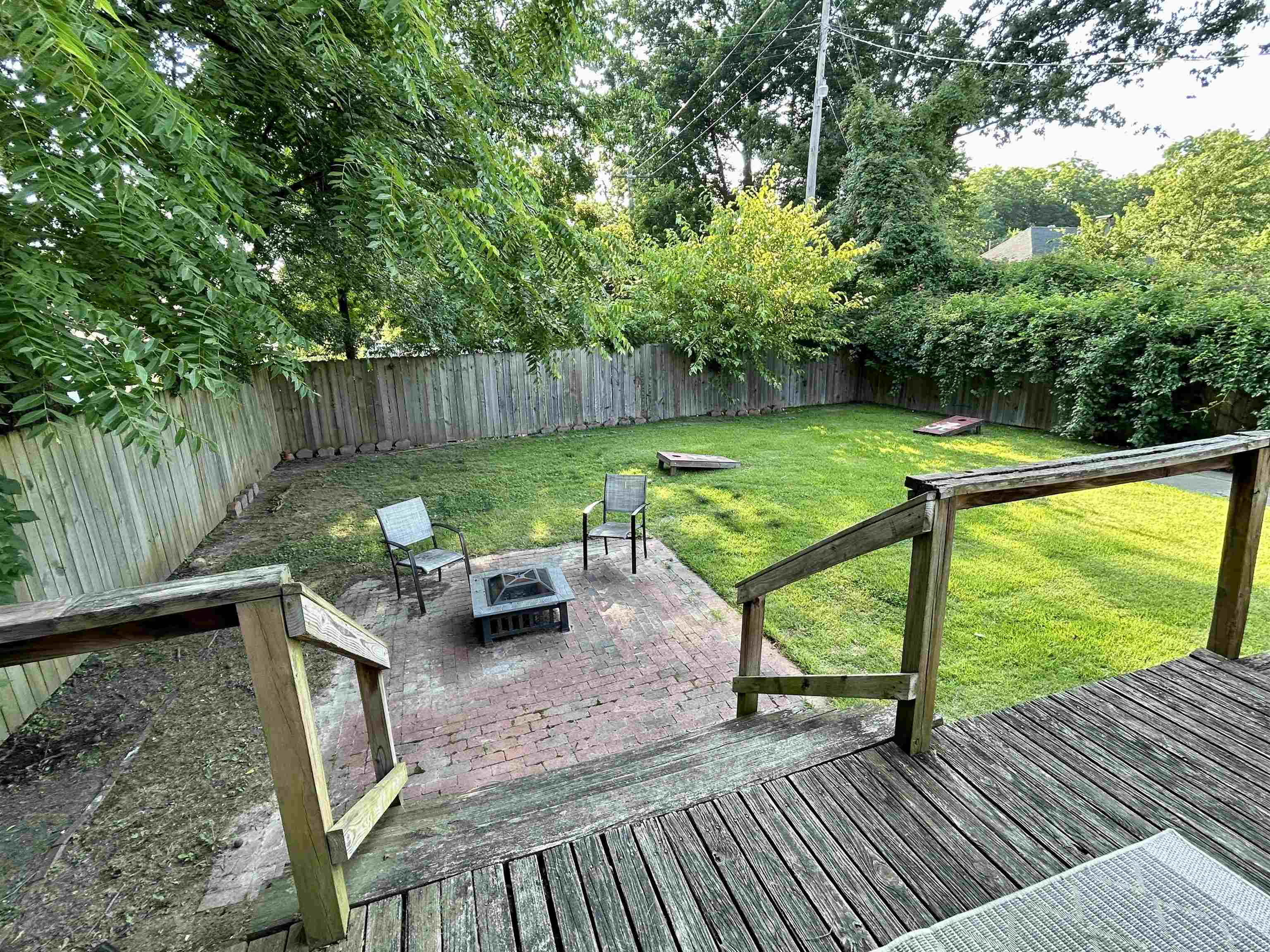 823 Cooper Street Memphis, TN 38104 - Photo 16 of 18 a view of a deck with chairs and a yard