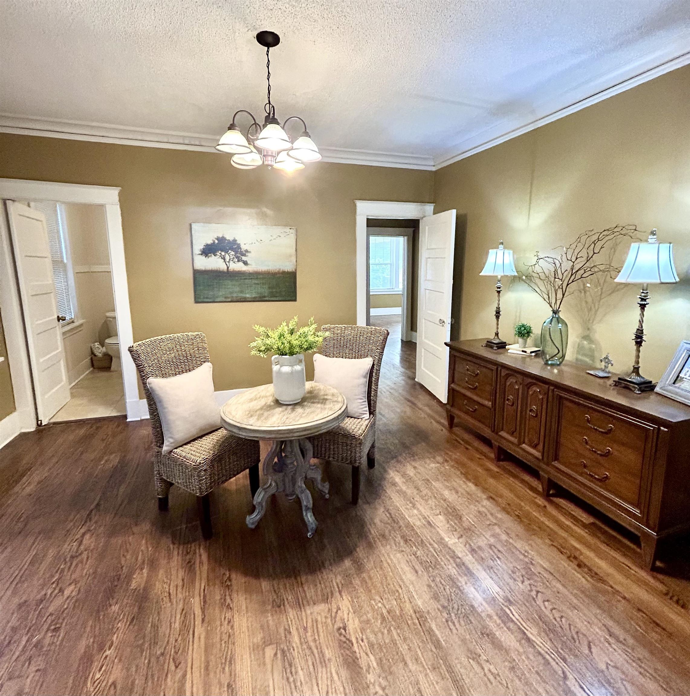 823 Cooper Street Memphis, TN 38104 - Photo 5 of 18 a view of a dining room with furniture and wooden floor
