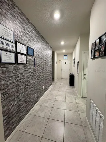 a view of a hallway with seating area