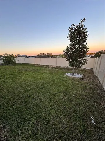a view of a yard with an outdoor space and seating