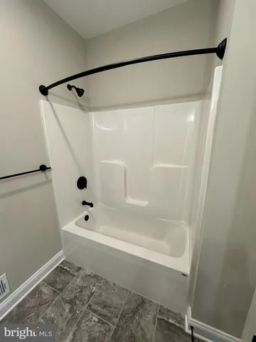 a bathroom with a shower and a toilet