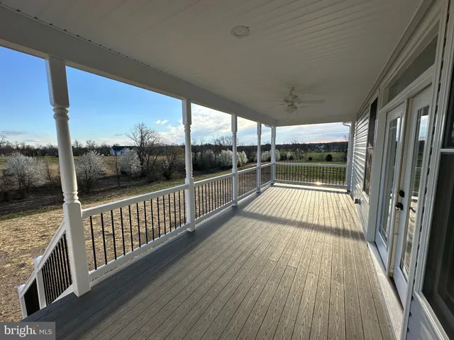 a view of a balcony with wooden floor