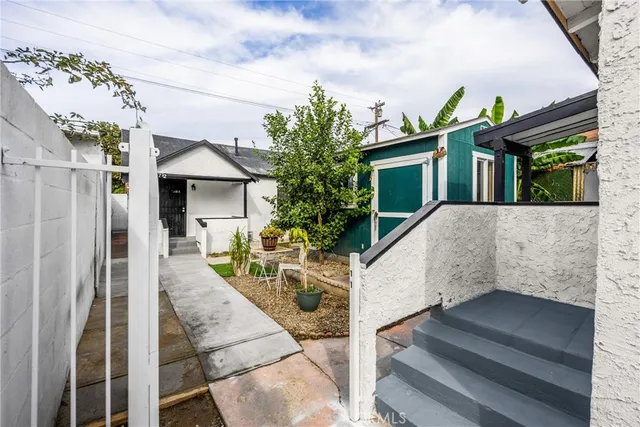 a view of a house with couches and balcony
