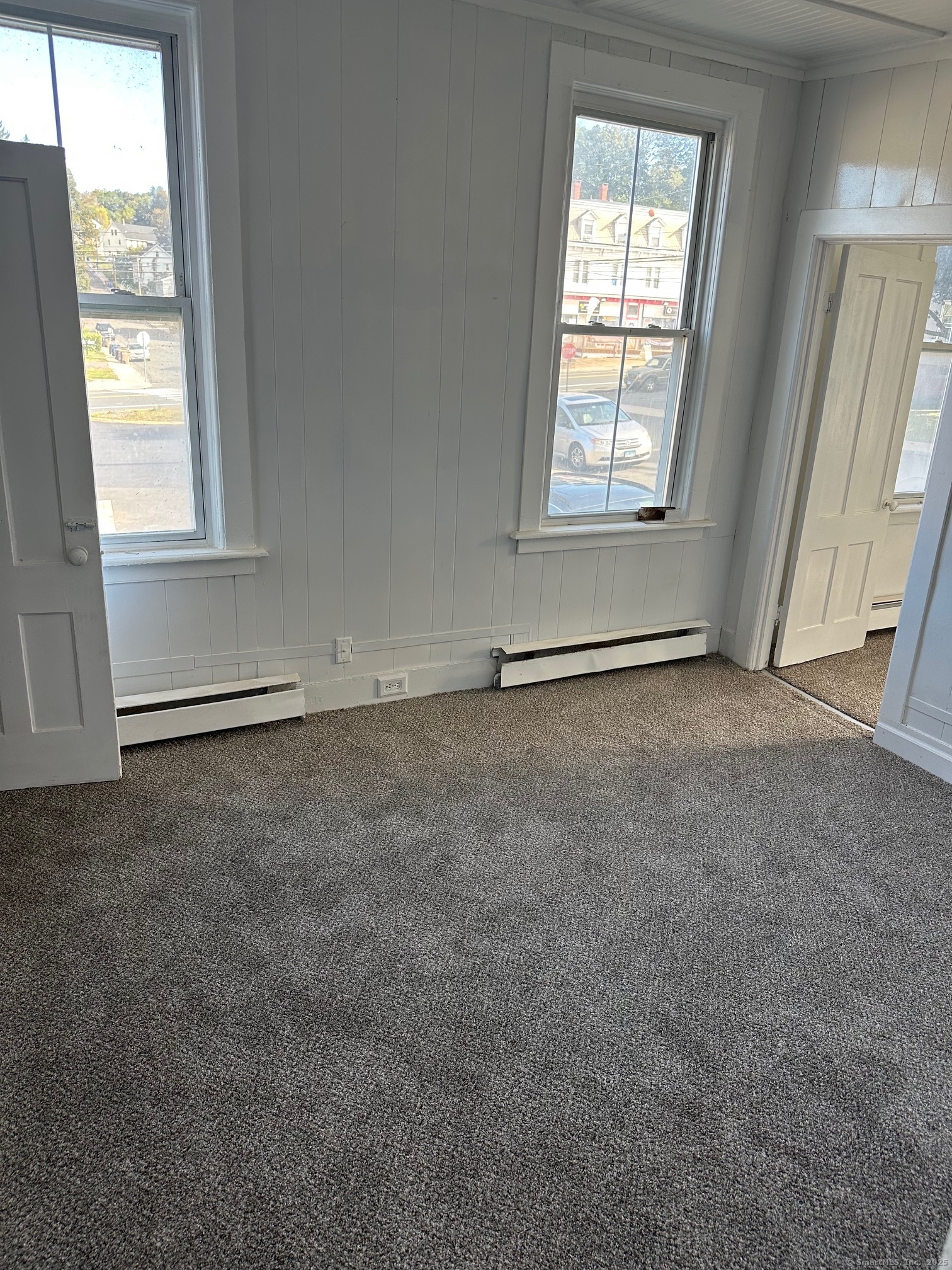 23 Ward Street, Unit 2 Vernon, CT 06066 - Photo 3 of 9 an empty room with windows