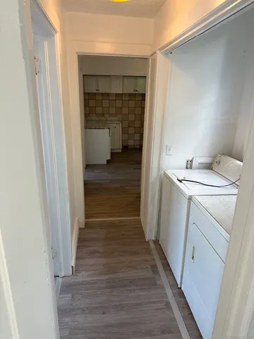 a hallway with washer and dryer