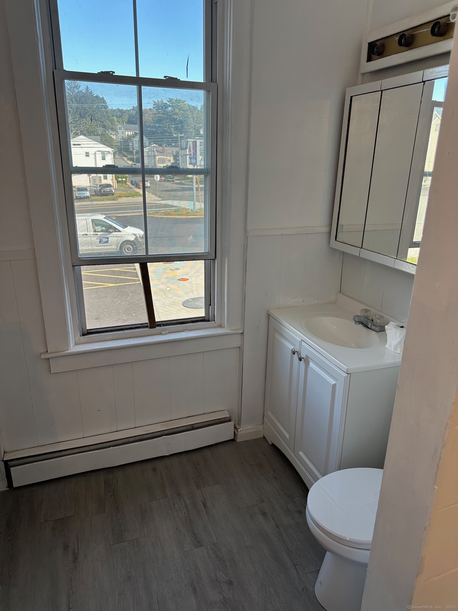 23 Ward Street, Unit 2 Vernon, CT 06066 - Photo 9 of 9 a bathroom with a toilet sink and window