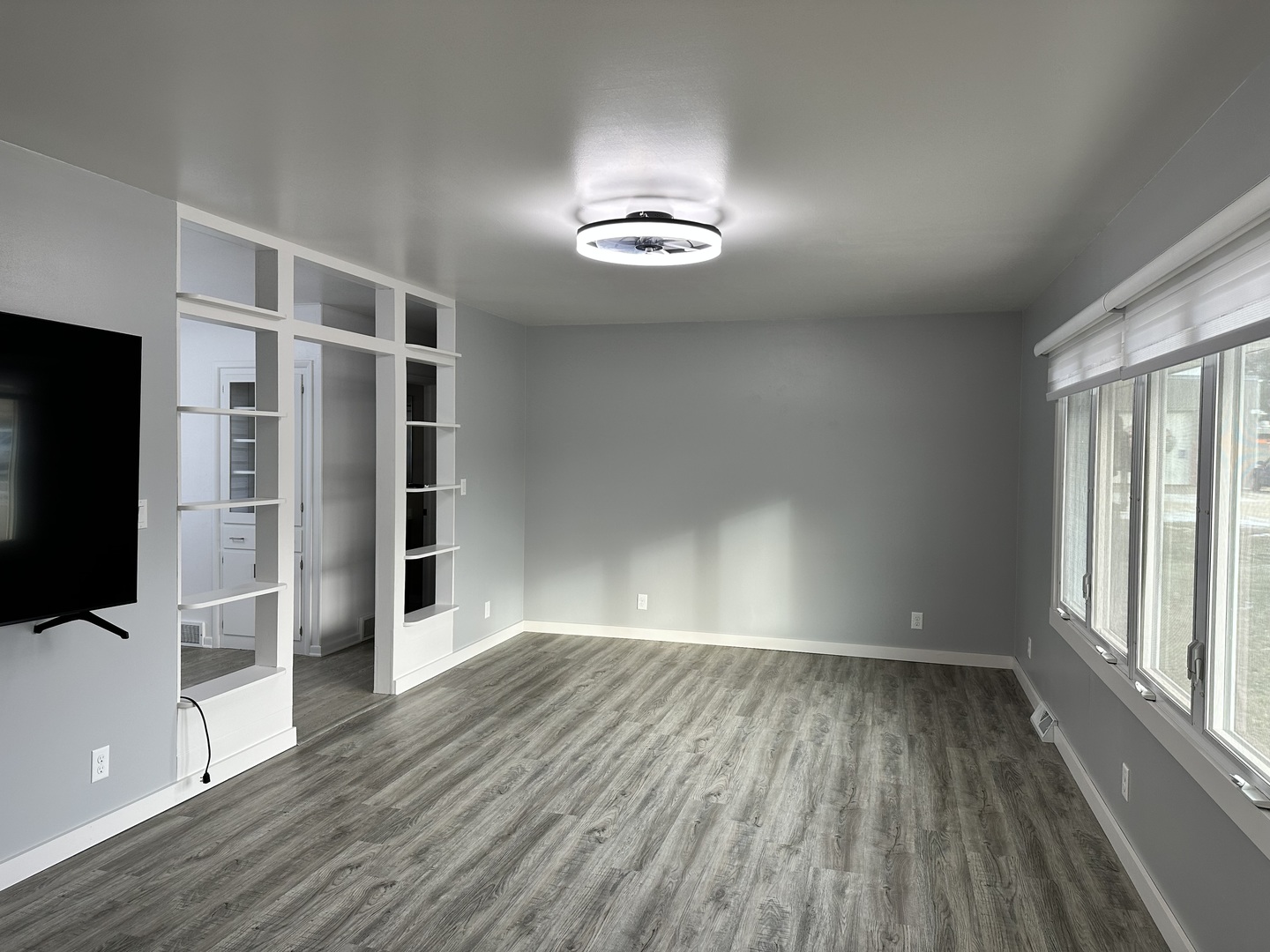 402 West South Street Preston, IA 52069 - Photo 11 of 21 wooden floor in an empty room with a window
