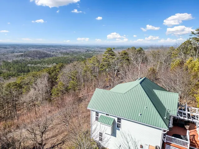 a view of a balcony with an outdoor space and seating