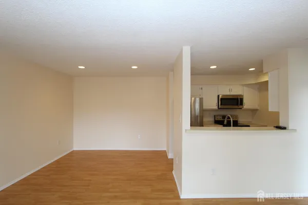 a kitchen with a sink and a refrigerator