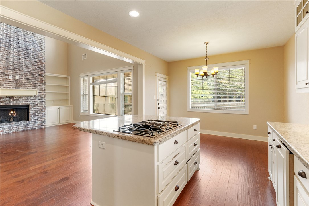 2136 Rockcliffe Loop College Station, TX 77845 - Photo 15 of 48 a kitchen that has a lot of cabinets and a wooden floor