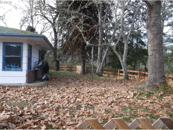 a view of a lush green hillside and a houses