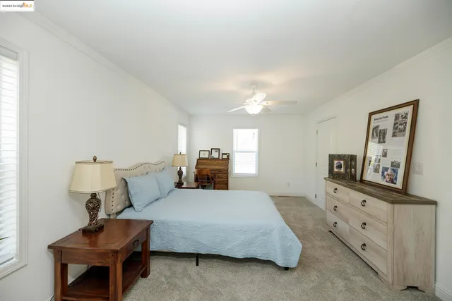 a bed room with a bed and a dresser