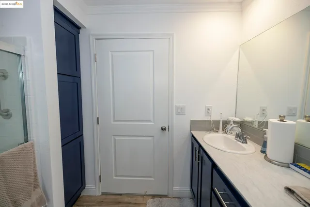a bathroom with a sink a mirror and a vanity
