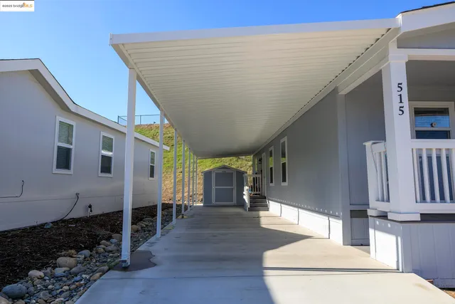 a view of living room kitchen and entryway
