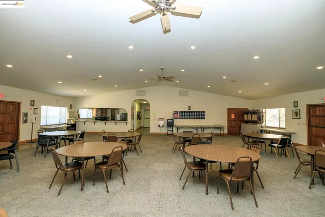 a view of a patio with a dining table and chairs