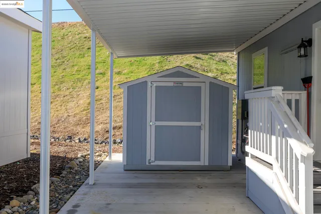 a view of porch with a yard