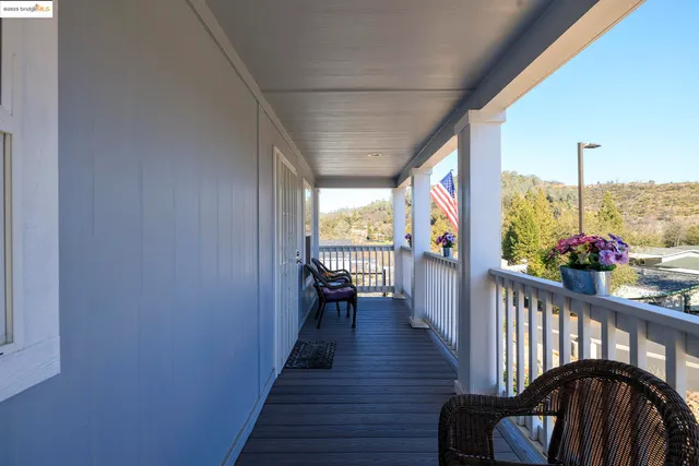 a view of two chairs in the balcony