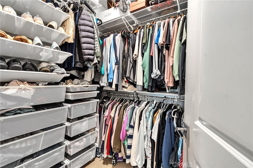 1200 Lasso Way, Unit 105 Rancho Mission Viejo, CA 92694 - Photo 13 of 43 a view of walk in closet with clothes and shoes