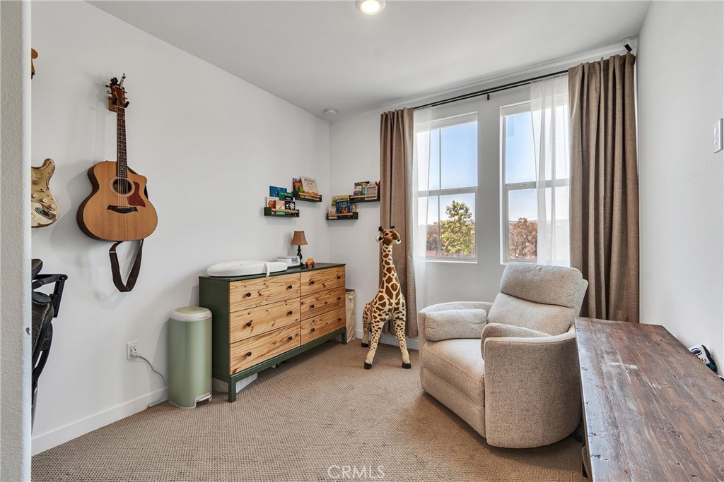 1200 Lasso Way, Unit 105 Rancho Mission Viejo, CA 92694 - Photo 15 of 43 a bedroom with furniture and windows