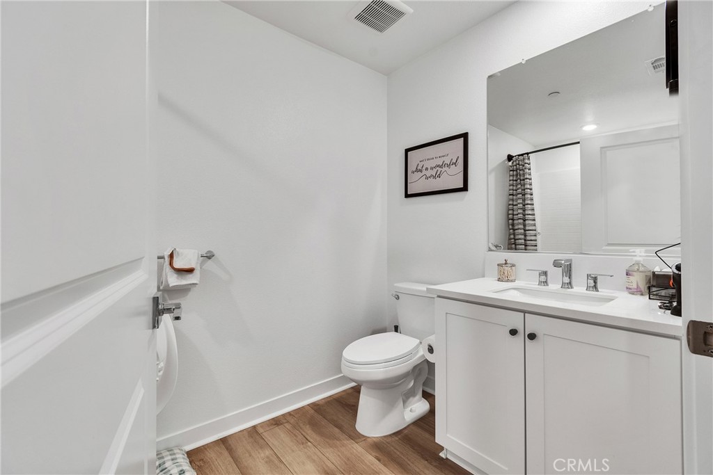 1200 Lasso Way, Unit 105 Rancho Mission Viejo, CA 92694 - Photo 16 of 43 a bathroom with a toilet sink and mirror