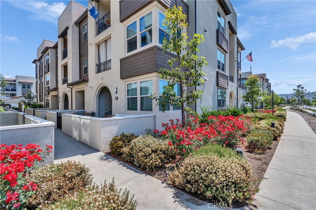 1200 Lasso Way, Unit 105 Rancho Mission Viejo, CA 92694 - Photo 23 of 43 a view of a garden with flower plants