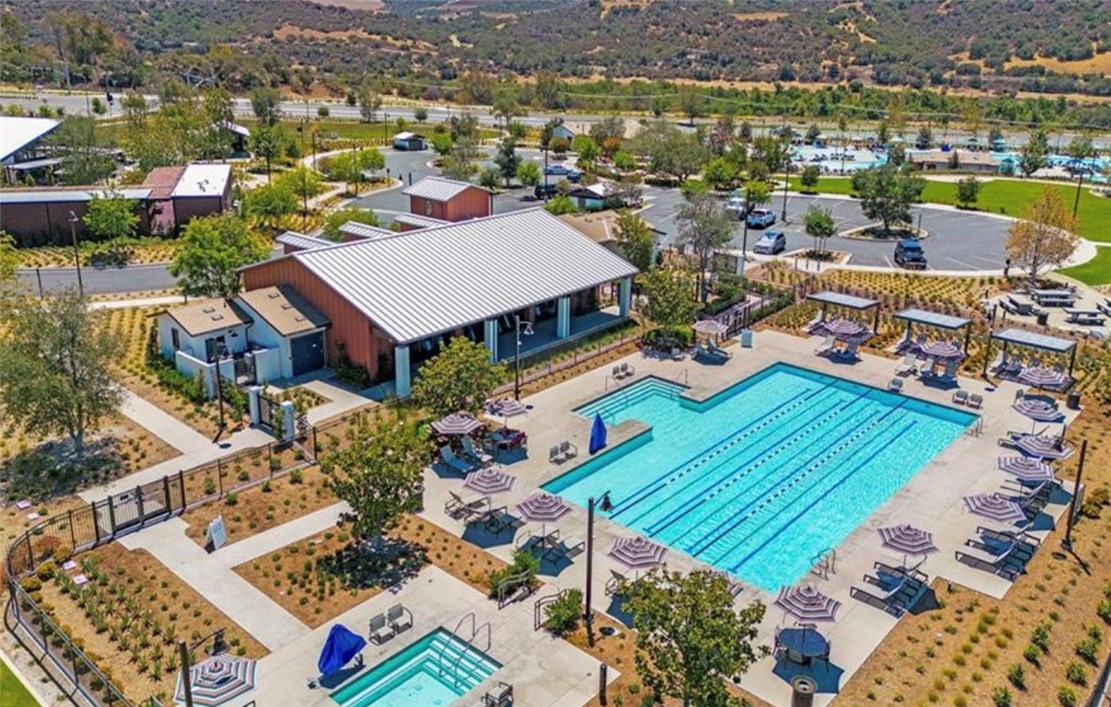1200 Lasso Way, Unit 105 Rancho Mission Viejo, CA 92694 - Photo 28 of 43 an aerial view of a houses with a lake view