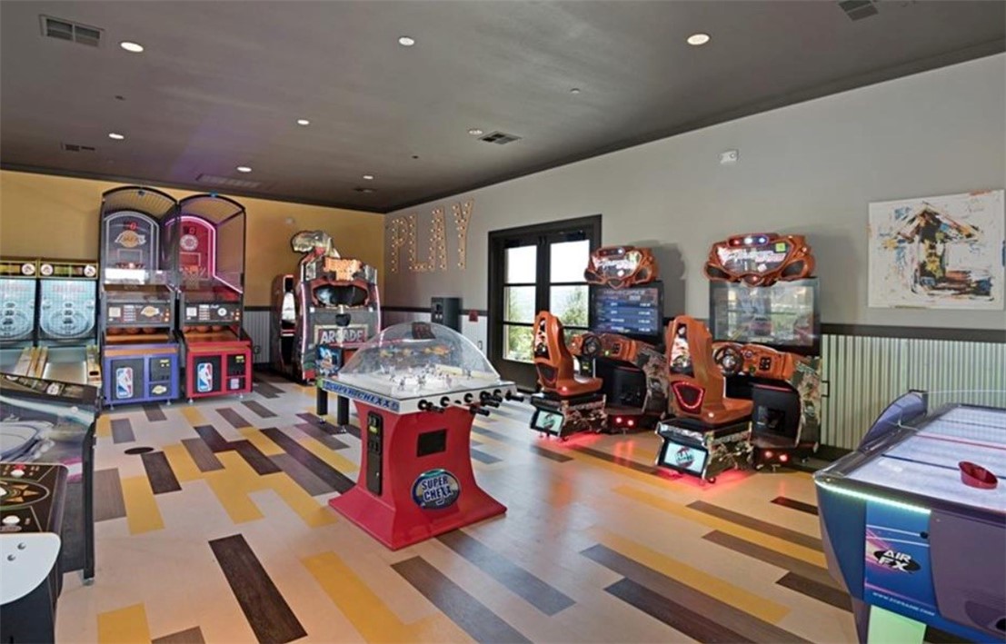 1200 Lasso Way, Unit 105 Rancho Mission Viejo, CA 92694 - Photo 36 of 43 a living room with lots of furniture and gym equipment
