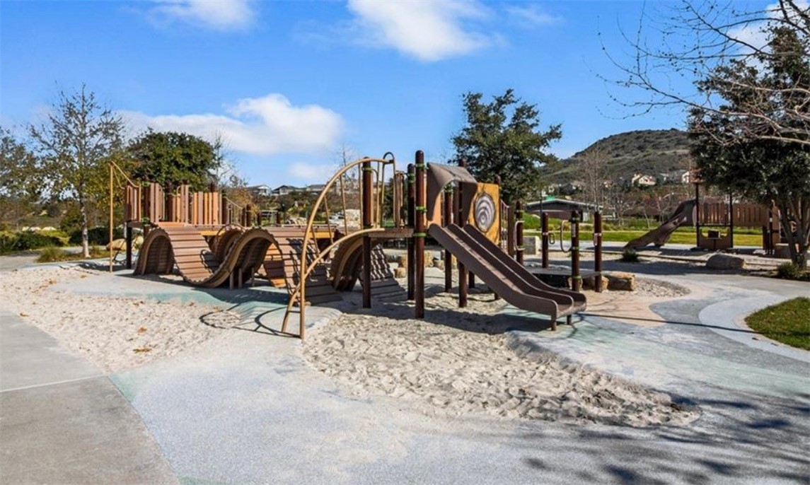 1200 Lasso Way, Unit 105 Rancho Mission Viejo, CA 92694 - Photo 39 of 43 a view of a park with swings and slides