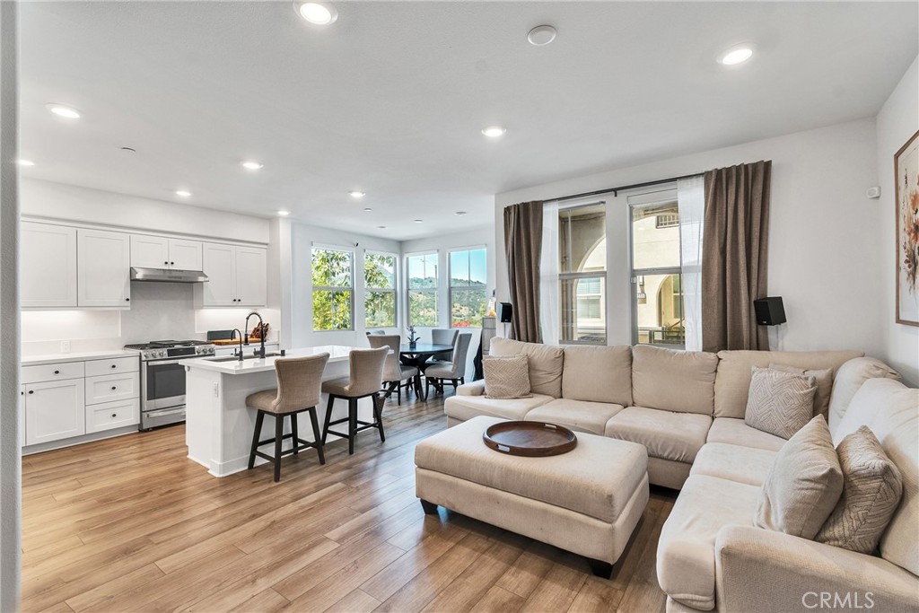1200 Lasso Way, Unit 105 Rancho Mission Viejo, CA 92694 - Photo 3 of 43 a living room with furniture flat screen tv and window
