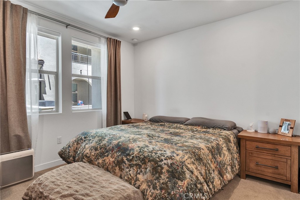 1200 Lasso Way, Unit 105 Rancho Mission Viejo, CA 92694 - Photo 9 of 43 a bedroom with a bed and with cabinets