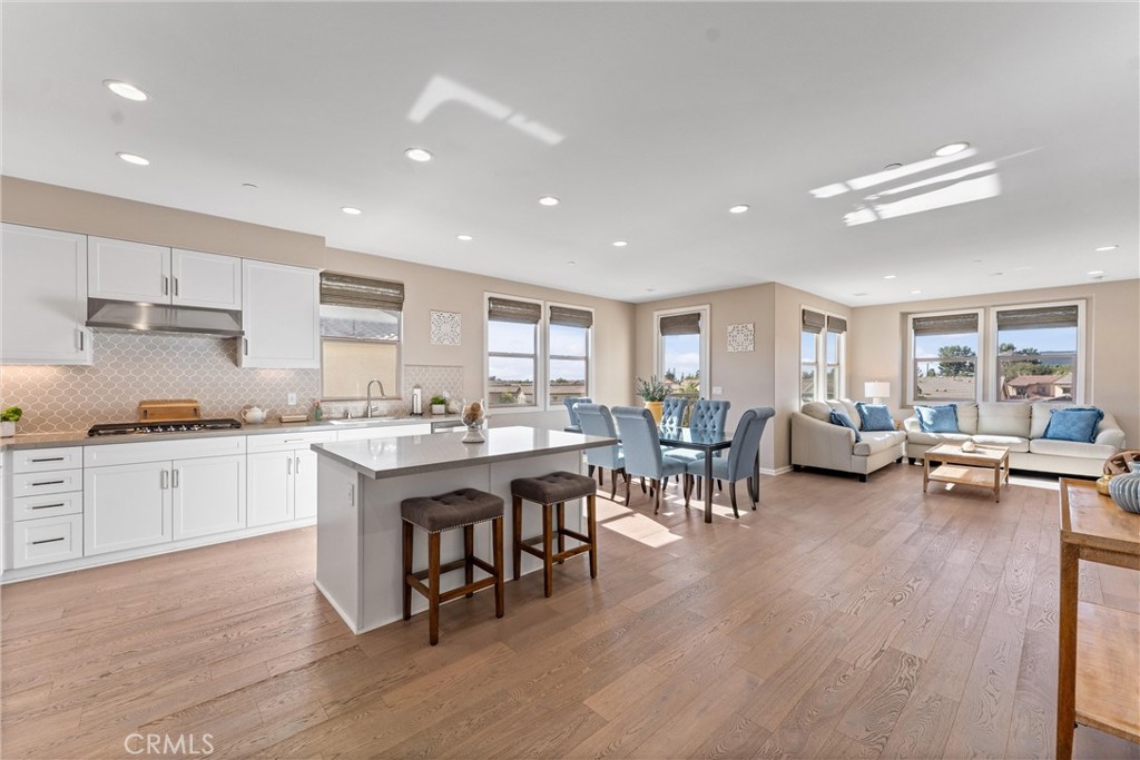 260 Buena Vida Drive, Unit 301 Brea, CA 92823 - Photo 6 of 50 a kitchen with lots of counter top space and living room